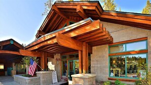 A building with a wooden exterior and large windows. - *New* Tahoe Donner Cabin*Swiss Chalet* (Truckee)