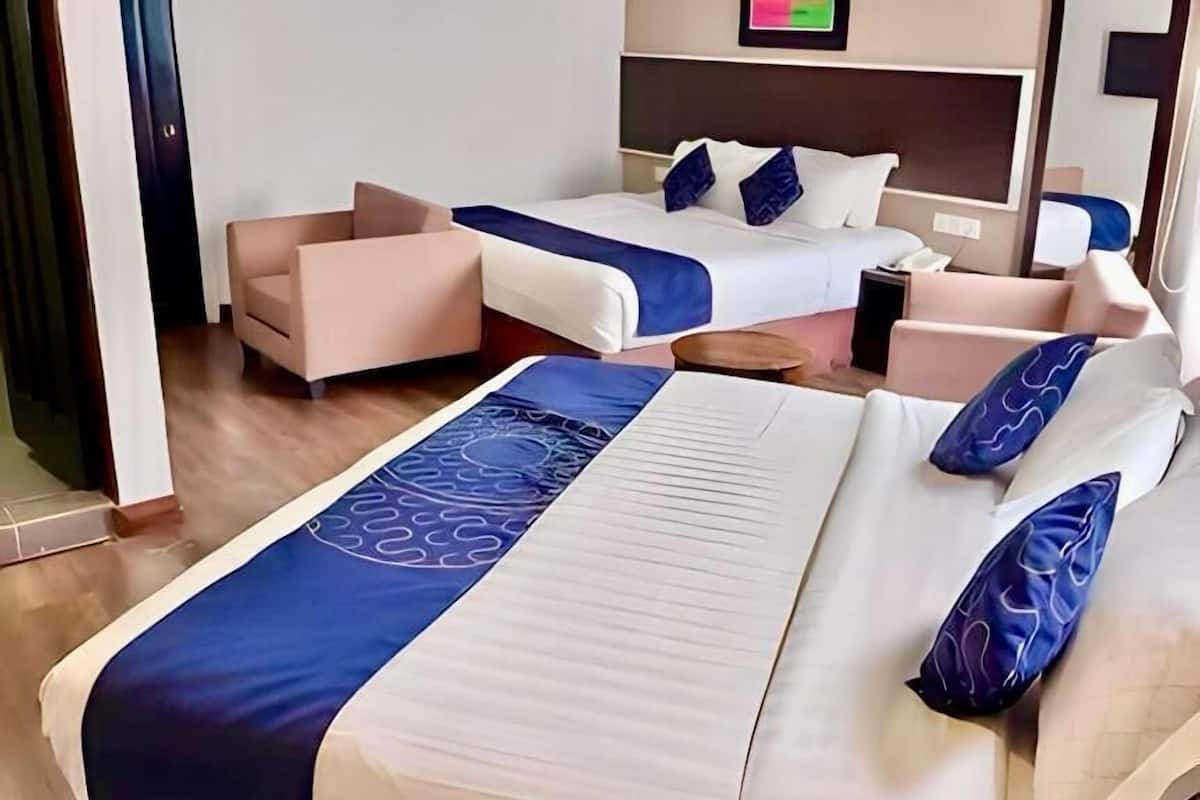 Executive vierpersoonskamer | Een kluis op de kamer, een bureau, geluiddichte muren, gratis wifi