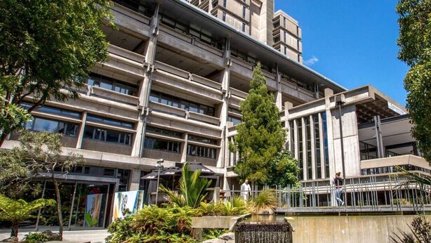 A modern building with a multi-story structure, a central courtyard with a water feature, and surrounding greenery. - Walk to Canterbury Uni has own private car park (Christchurch)