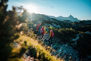 A group of hikers on a rocky trail with mountains in the background. - Pleasant Lodge in Hermagor With Sauna (Hermagor-Pressegger See)