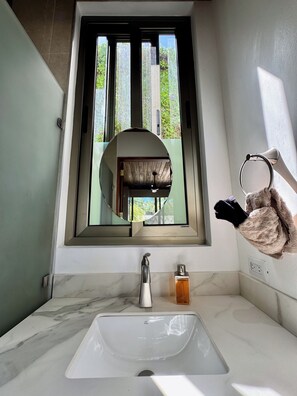 Eco-friendly toiletries, hair dryer, towels, soap