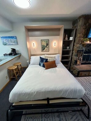 Tabla de planchar con plancha, wifi gratis, ropa de cama