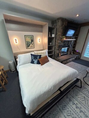 Tabla de planchar con plancha, wifi gratis, ropa de cama