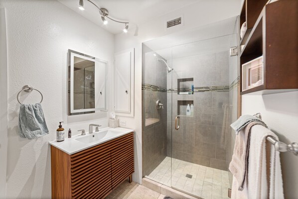 Shower, hair dryer, towels, soap