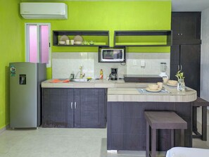 Fridge, microwave, stovetop, coffee/tea maker
