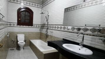 Shower, jetted bath, towels, soap