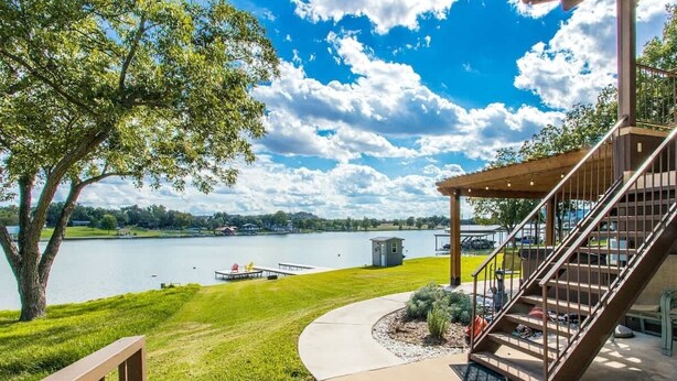 A lakeside view with a gazebo, a staircase, and a dock. - Bluebonnet Surprise-Lakefront, Hot Tub, Boat Slip (Kingsland)
