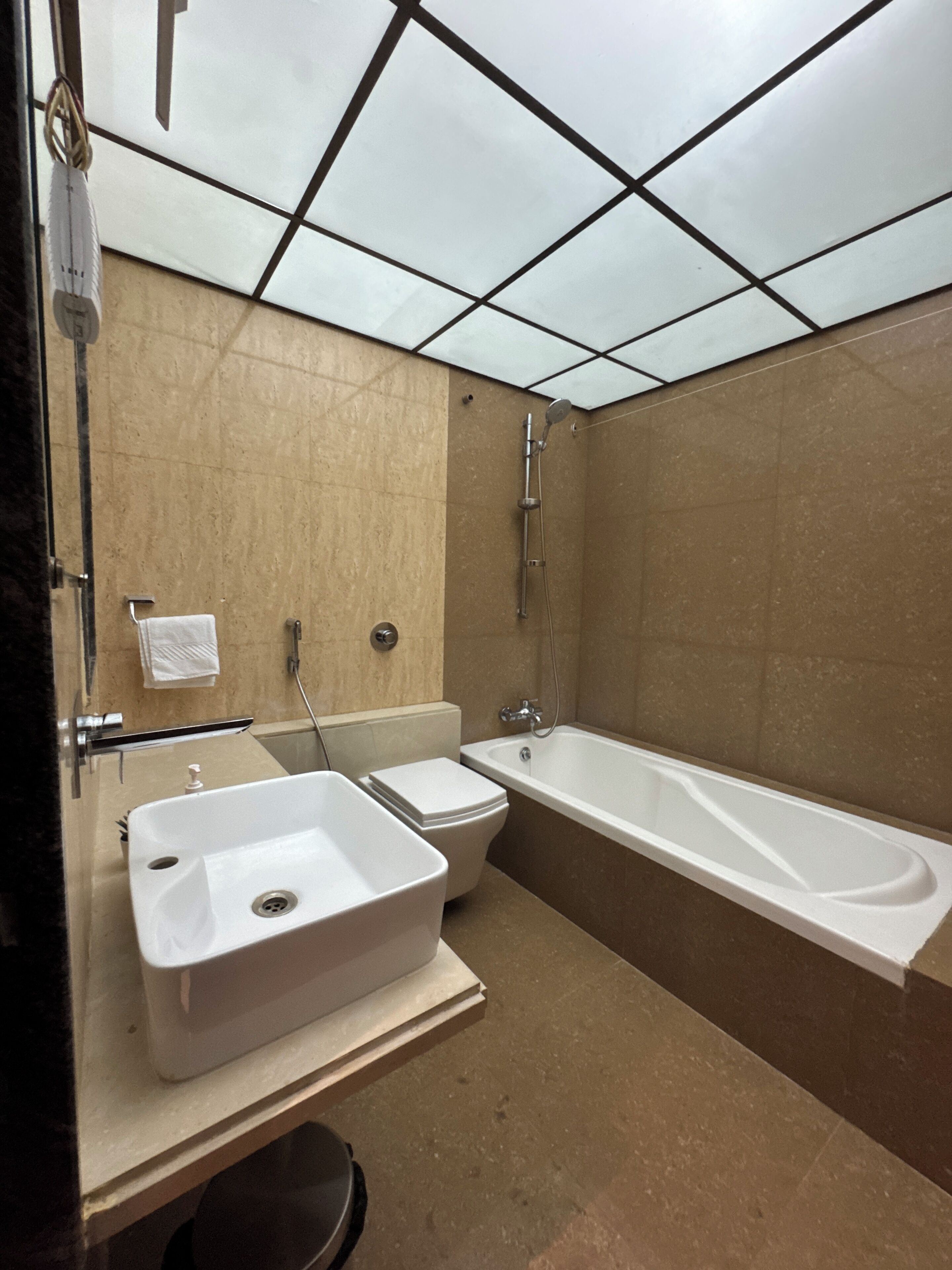 A bathroom with a sink, toilet, and bathtub.