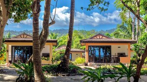 A resort with two buildings, each with a covered patio and a view of the sea. - Dianao Beach Club and Resort (Casiguran)