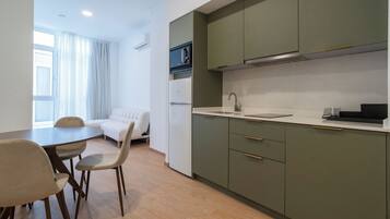 Fridge, microwave, stovetop, coffee/tea maker