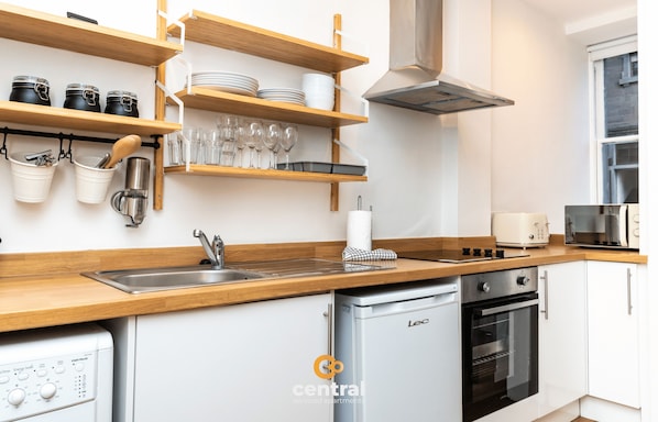 Fridge, microwave, toaster, cookware/dishes/utensils