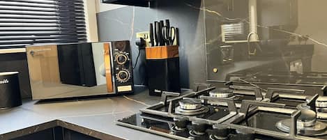 Fridge, microwave, toaster, cookware/dishes/utensils