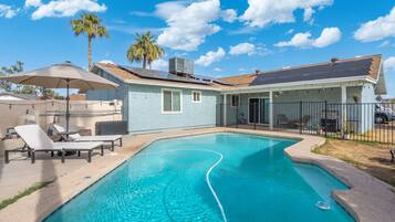 Outdoor pool, pool umbrellas, sun loungers