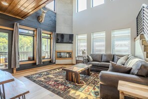 Televisie, een open haard, videospelletjes en een printer