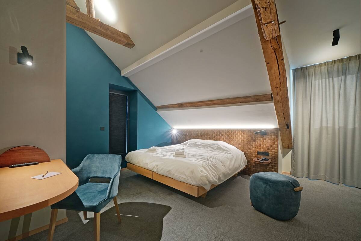 Premium bedding, desk, laptop workspace, soundproofing