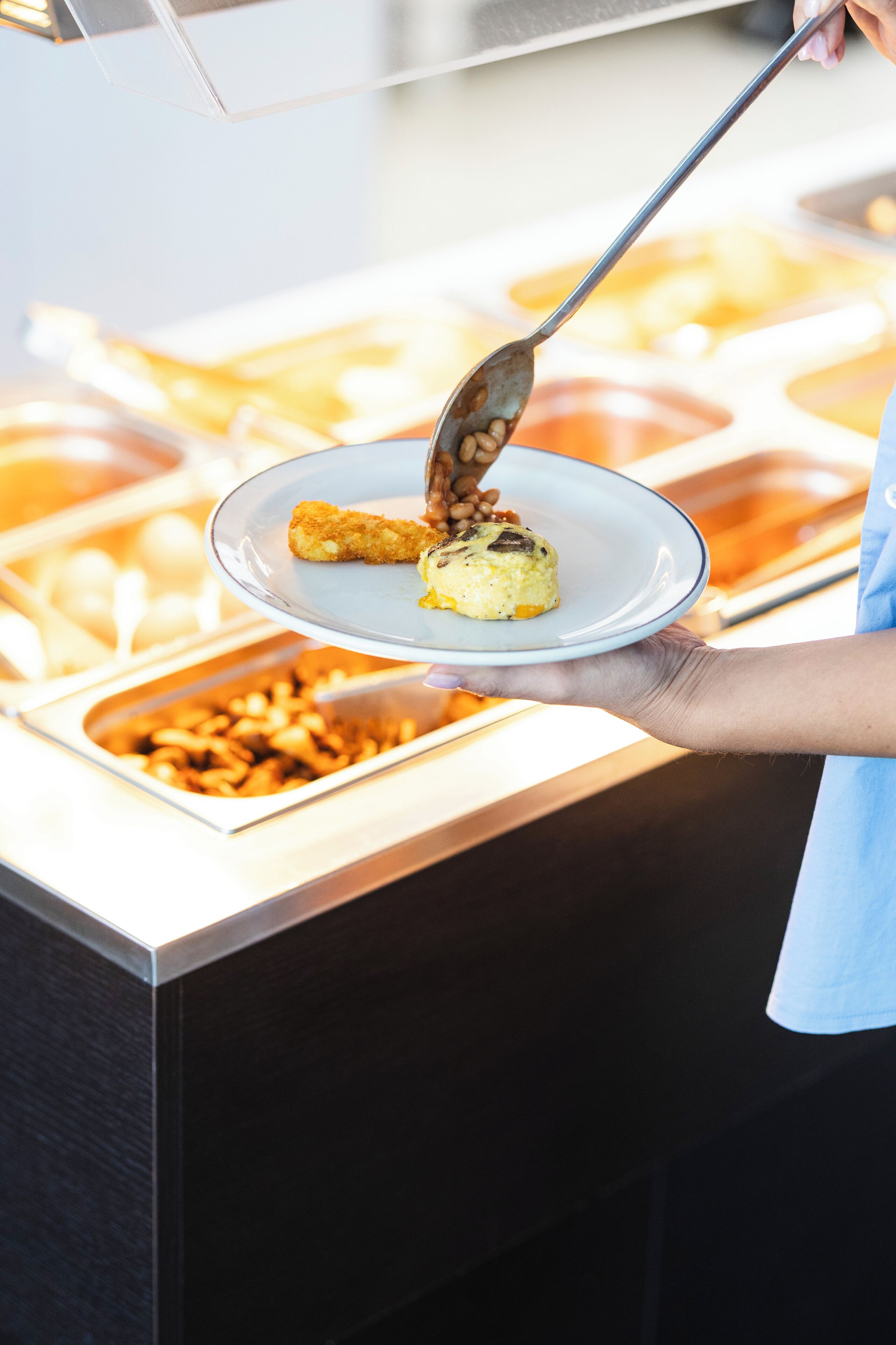 A buffet setup with various food items.
