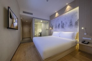 Habitación individual Confort | Caja fuerte, cortinas opacas, sistema de insonorización