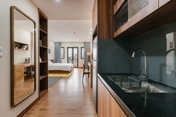 Full-size fridge, stovetop, cookware/dishes/utensils, paper towels - Railway Apartment (Hanoi)