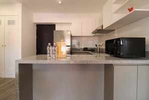 Fridge, microwave, stovetop, coffee/tea maker