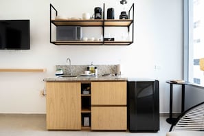 Fridge, microwave, stovetop, coffee/tea maker