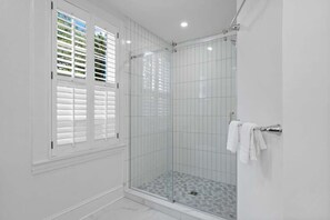 Shower, hair dryer, towels, shampoo