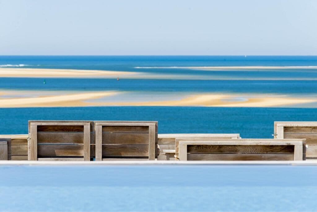 Beach nearby, white sand, beach towels