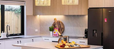 Coffee/tea maker, fridge, microwave, oven