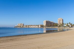 A coastal hotel with a beachfront view, multiple floors, and a sandy beach. - Amazing Between Two Seas by Fidalsa (Murcia)