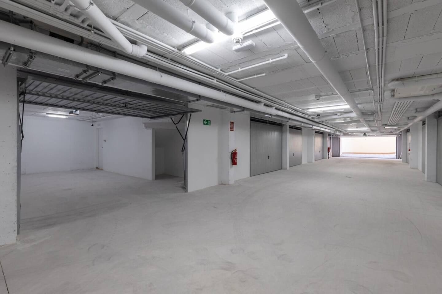 A large, empty parking garage with multiple levels and a central walkway.