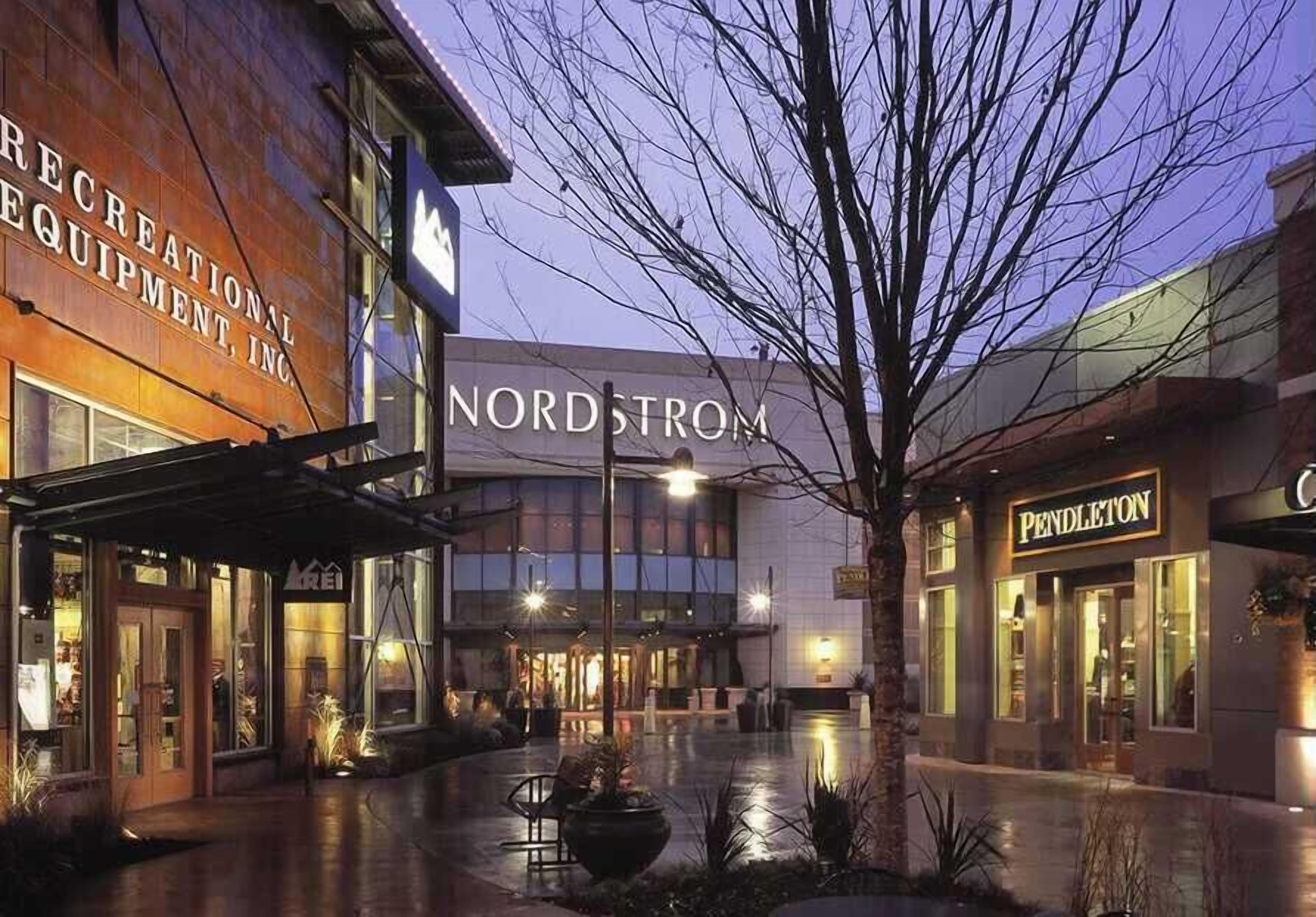 A commercial building with signage for 'NORDSTROM' and 'PENDLETON' businesses.