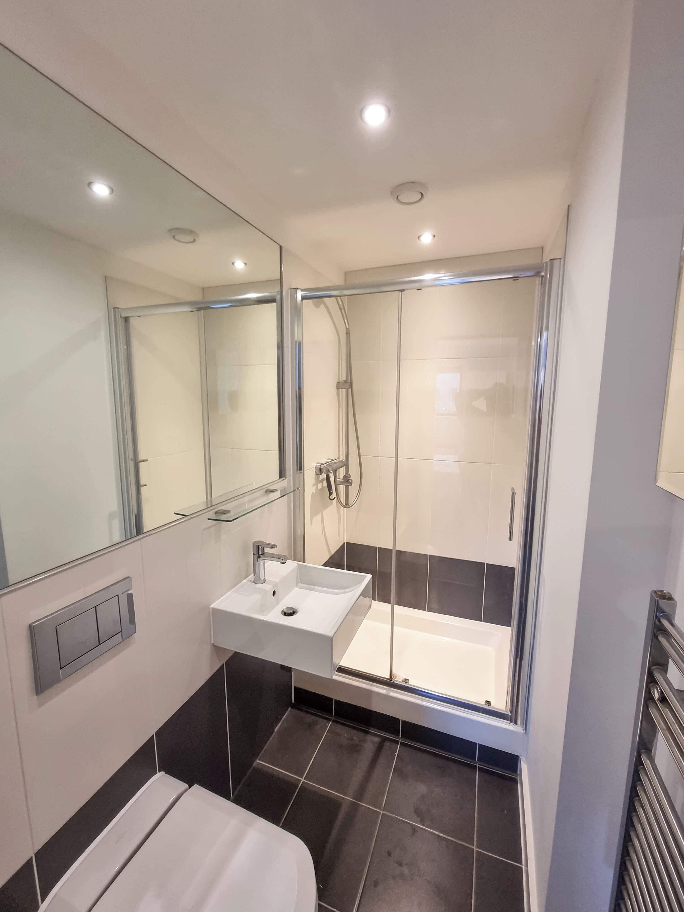 Shower, hair dryer, towels, shampoo
