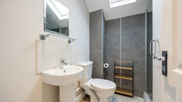 Shower, towels, soap, toilet paper