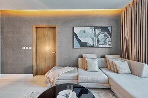 Premium Apartment, 1 Bedroom | Living room | 50-inch Smart TV with satellite channels