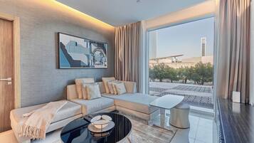 Premium Apartment, 1 Bedroom | Living room | 50-inch Smart TV with satellite channels