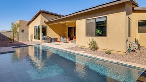 A modern house with a swimming pool, a patio with outdoor furniture, and a clear blue sky. - Mtn Views, Pool & Hot Tub: Phoenix Oasis (Phoenix)