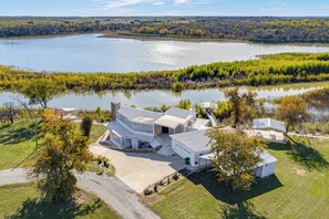 House (3 Bedrooms) | Front of property - Dock & Fire Pit: Riverfront Runaway Bay Retreat (Bridgeport)