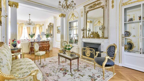 A luxurious room with ornate gold detailing, a grand mirror, and a classic fireplace. - Parisian Villa: City Views, 5 Bedrooms & Family-Friendly (Paris)