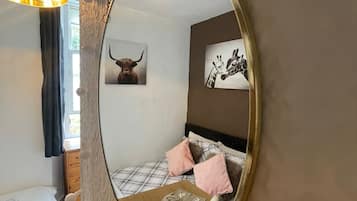 1 bedroom, desk, iron/ironing board, travel crib