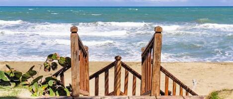 On the beach, sun-loungers, beach towels