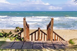 On the beach, sun loungers, beach towels