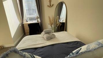 1 bedroom, desk, iron/ironing board, travel crib