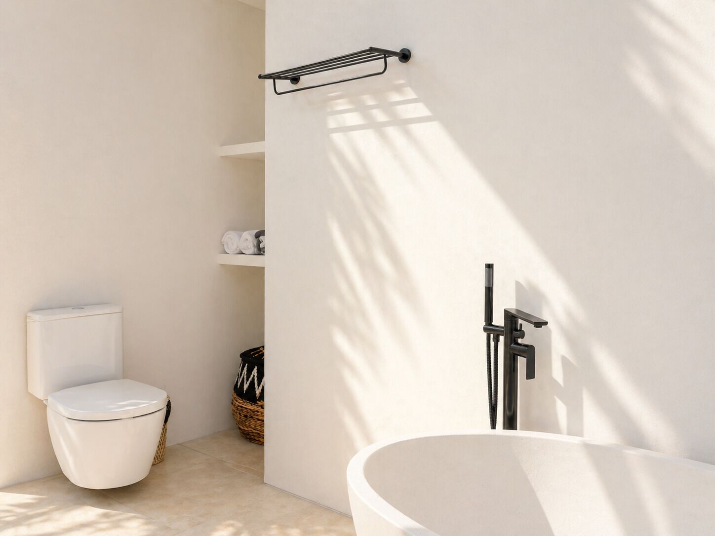 A modern bathroom with a toilet, a white sink, and a bathtub.
