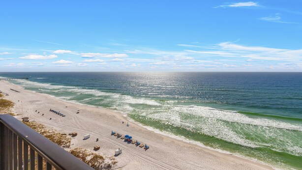 A beach with a pier extending into the ocean, sandy beach, and a clear sky. - 1201 Fall Beachfront Escape—3BR/3BA, Wraparound Balcony, Beach Service (Panama City Beach)