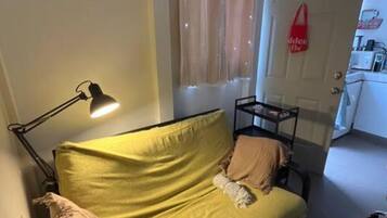 Standard Apartment | Living area | 65-inch Smart TV with digital channels, Netflix, first-run films