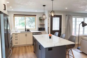 Fridge, stovetop, coffee/tea maker, cookware/dishes/utensils