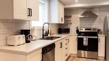 Fridge, stovetop, coffee/tea maker, cookware/dishes/utensils