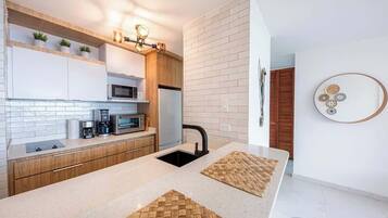 Fridge, microwave, stovetop, coffee/tea maker