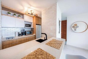 Fridge, microwave, stovetop, coffee/tea maker