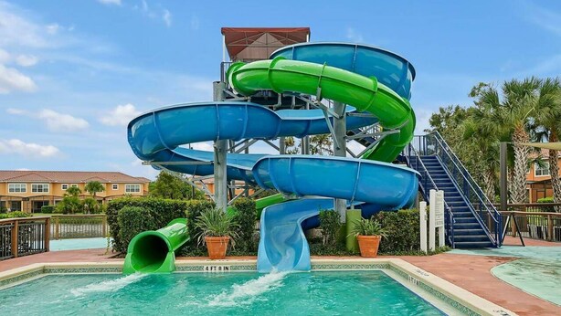 A water park with multiple slides and a pool. - Beautiful Townhome, Old Town (Kissimmee)