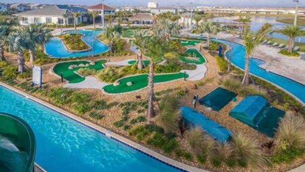 A swimming pool with a golf course and palm trees. - Serene Rhyme Escape - Five Bedroom House, Sleeps 10 (Kissimmee)